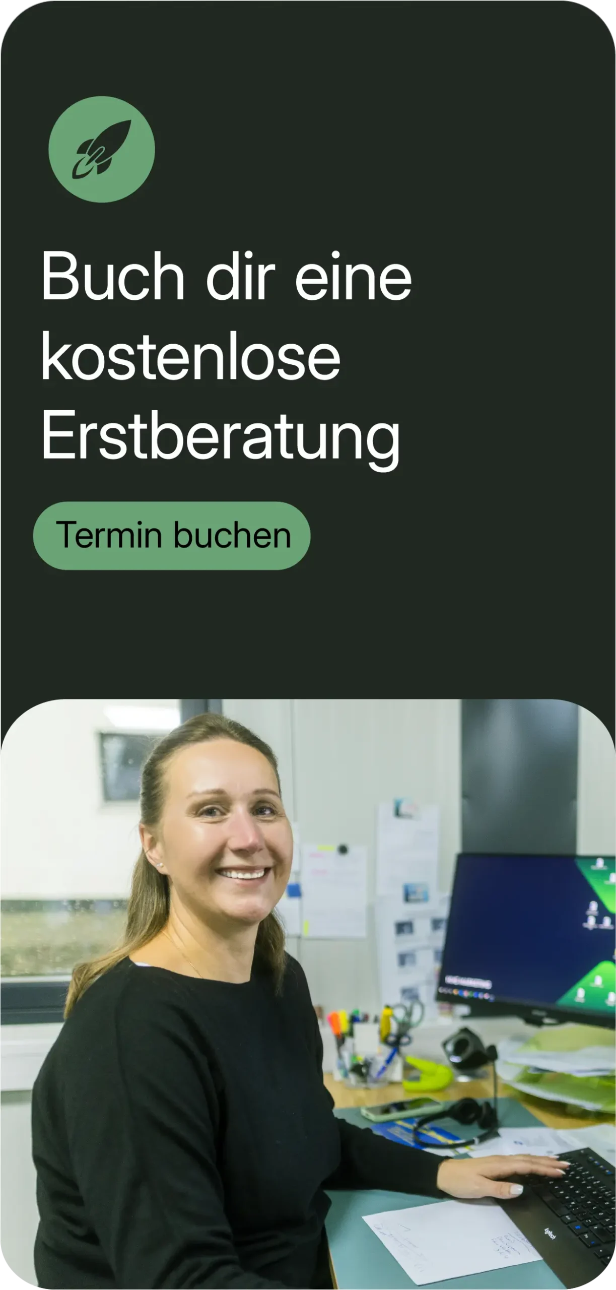 Portrait of a smiling woman at the desk in the office, in front of a computer screen. Above it is written: 'Book a free initial consultation', with a green button 'Book an appointment'